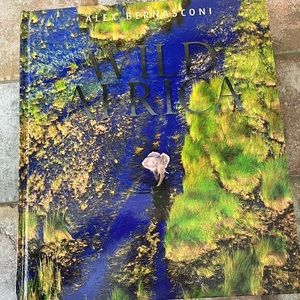 Wild Africa coffee table book. 9”w x 11”h.